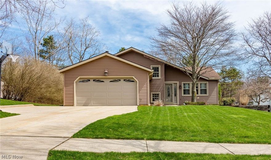 Get Ready To Be Impressed!! This magnificent Split Level 3 BR/2Full Baths is nestled on a Cul-de-sac in a neighborhood with matured trees!! This home has a very inviting curb appeal and a welcoming home feel! Feel the pride of ownership w/MANY new updates throughout! Hole house windows and patio slider w/screen 8/2013.  Vinyl siding (3/8 polymer skin), soffit and facia capping, gable vents, exterior light fixtures, 5” seamless gutters and downspouts 8/2013.  The home provides neutral decor throughout! The stunning front door has leaded glass that provides natural light as you enter the warm inviting formal living and dining room, including vaulted ceilings, that is fantastic for entertaining. The well maintained eat-in kitchen boasts charm and a window that looks out to the backyard!! Spacious family room includes a brick wood burning fireplace and newer carpeting that welcomes you to stay and relax! Freshly painted master bedroom with new carpet! Slider leads to a large backyard w/mat