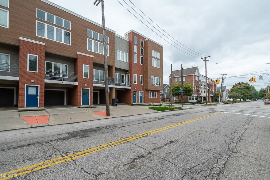 Beautiful TAX ABATED townhome.  Built in 2014. Beautifully upgraded townhome on Bridge Avenue in Waverly Station. Built-in one car garage space on lower level plus 3 levels of quality living space including a roof deck and wet bar on the top floor. Balcony on the second floor off the living room. Gorgeous bamboo floors and a view of Downtown Cleveland. Close to wonderful restaurant and entertainment facilities, public transportation and all the great aspects of urban living in the exciting Detroit Shoreway neighborhood of Cleveland.