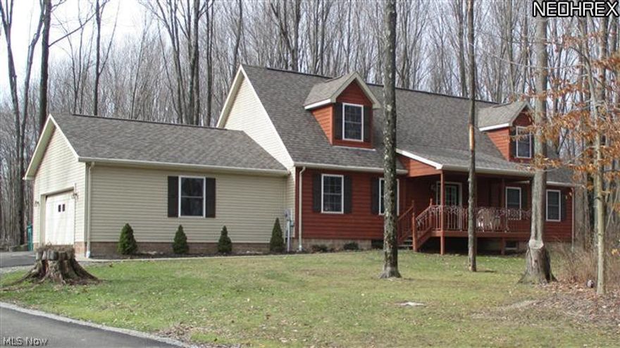 Spectacular Vinyl and Cedar Sided Cape Cod on a wooded lot.  There are many nice features for convenient about this home, welcoming front porch and secluded back deck, laundry room and 1/2 bath just in inside the door from the attached 2 car garage, kitchen with lots of cupboards and counter space galore, 1st floor master bedroom with master bath and walk in closet, an office area and 2 bedrooms upstairs with a full bath, and a full basement too!