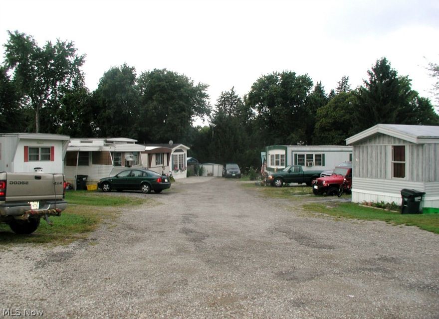 Great potential for older business-this reliable trailer park, with 10 pads, has been a steady income for many years-additional lot for parking and each pad has a parking space. Become your own boss and run your own business. City utilities. All mineral, gas and oil rights transfer.