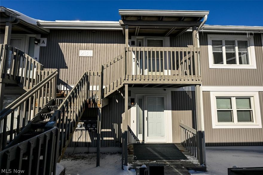 Bathed in natural light and finished in a soothing, neutral palette, this immaculate top-floor condo is truly move-in ready. Featuring 2 generously sized bedrooms, a versatile loft, and 2 full baths, the home is defined by soaring ceilings and an open, airy ambiance. The living room is warm and inviting with a cozy fireplace and dramatic vertical space, making it the perfect place to unwind or entertain.

Step into the fabulous three-season porch and imagine slow mornings with coffee, breezy afternoons, and relaxed evenings, all while overlooking the surrounding area. The updated, fully appliance kitchen is both beautiful and functional, showcasing new cabinetry, expansive countertops, and abundant natural light that makes everyday cooking a pleasure.

The laundry room adds convenience and storage. The thoughtful layout of the loft offers privacy and flexibility for guests, a home office, or a creative space.

Located in the heart of Portage Lakes, this condo offers a vibrant, walkable lifestyle just steps from beloved local spots like Rose Villa, Molly Brown’s, and Biggins. Enjoy low-maintenance living with dining, entertainment, and lakeside charm right outside your door. This is effortless living at its best.