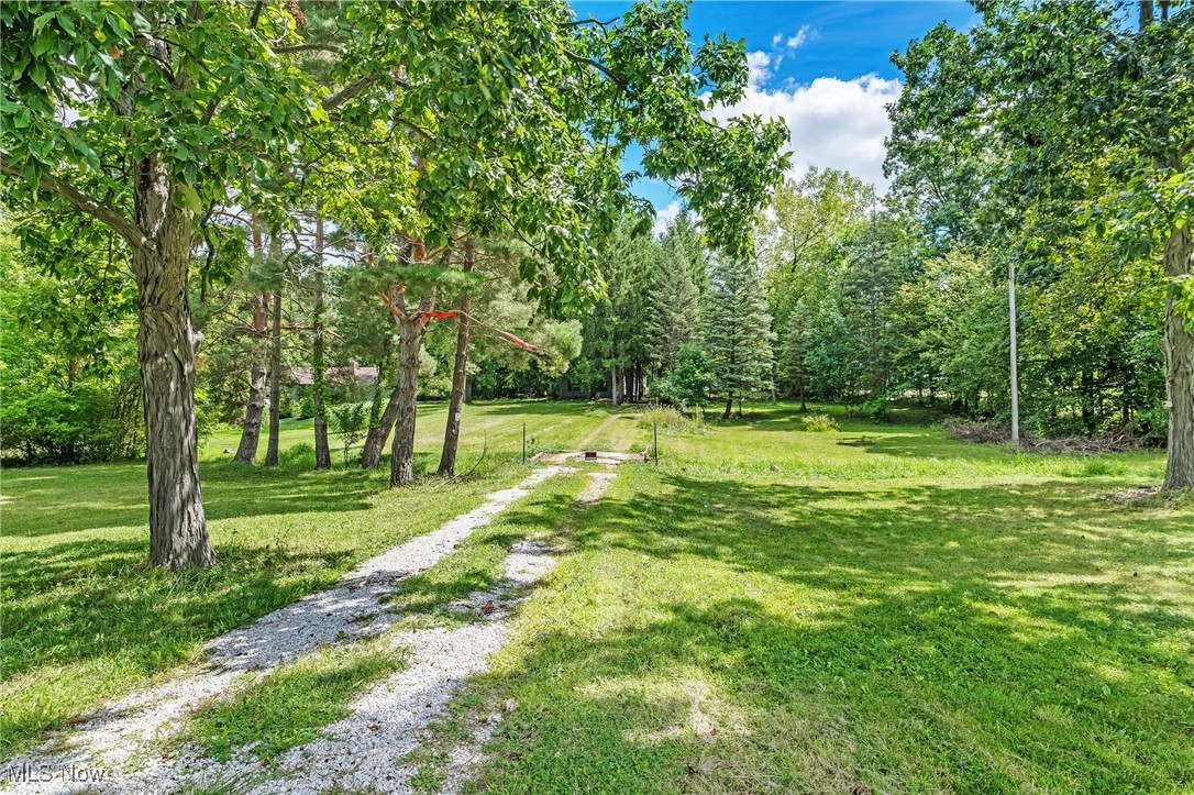 Welcome to 18229 Howe Rd in Strongsville, an incredible opportunity to own 1.85 acres in one of the city’s most desirable locations. While the existing home may require significant renovation or removal, the true value lies in the land itself. This expansive lot, with a creek in the front, offers wide open green space with plenty of room to design and build your dream home, investment property, or development project. Conveniently located in the heart of Strongsville, the property is just minutes from SouthPark Mall, countless restaurants, schools, and everyday conveniences. With its prime location and generous acreage, this property provides endless potential for investors, builders, or homeowners looking to create something special in a thriving community.