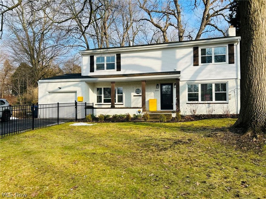Fall in love with this classic West Akron Colonial Home sitting on 0.22 acres on a tree lined street. This home is surrounded by beautiful mature trees with a large concrete back patio (9x30) overlooking this serene back yard. New black aluminum fence in the front yard was installed in April 2025, featuring two oversized gates for easy access to the front walkway from the driveway or through to the backyard. Walking distance to Parks, playgrounds, restaurants, grocery stores, library, and other entertainment. Easy access to I-77. This 4-bedroom, 2.5-bath home has been tastefully remodeled over the last 2 years. New kitchen features, quartz countertops, tile backsplash, soft close cabinets with crown molding, recess lighting and tile floors. Flows seamlessly into the dining room with recess lighting, and a stylish Cane Wood Center Table Pendant. Full glass view backdoor off the dining room for easy access to backyard. Expansive living room centered by the stone-faced wood burning fireplace with granite hearth; let the sunshine in with an abundance of large windows covering both North & West sides of the home. Custom blinds throughout. Fully remodeled Half bath and convenient 1st floor bedroom (currently being used as an office) round out the downstairs. Upstairs you will find three generous sized bedrooms, including a large primary that features a custom accent wall, walk in closet and oversized ensuite. Ensuite features tile shower, with custom glass doors, double vanity with quartz counter tops, and built ins. Second full bath includes tub with tile surround and tile floors. Second floor laundry for convenience. Home features all original hardwood floors that have been refinished. Some additional updates include Atlas Gutter Guards (2025), Keyless Entry Front Door (2025), Larson Storm door with retractable Glass/Screen (2024), Whole house Double Hung Vinyl windows, and Adorn mailbox. New Garage Door with opener and keypad.