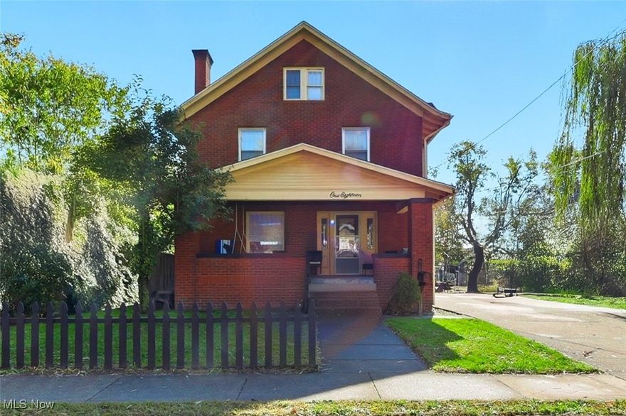 This charming century-old brick home is filled with character, warmth, and timeless craftsmanship. Step inside and you’ll immediately notice the soaring ceilings and original woodwork that tell a story all their own. From the built-in cabinetry to the wood-burning fireplace, every detail feels like home.
The kitchen opens beautifully to the dining area, creating a welcoming flow for both everyday living and entertaining. A cozy sit-up bar connects the spaces — perfect for morning coffee chats or helping with homework while dinner simmers.
Upstairs, you’ll find three generous bedrooms and a spacious full bath with both a soaking tub and separate shower — rare for a home of this era. The third-floor bedroom adds flexible space for a guest suite, home office, or creative retreat.
Off the kitchen, a mudroom keeps life organized  and steps out into the backyard. Out front, a covered front porch — the kind that begs for a pair of rocking chairs and quiet evenings watching the world go by. The extra-wide driveway offers plenty of parking, and the nearly 2,300 square feet of living space gives you room to grow.
Just down the street from the local library and high school, this location offers walkable convenience in a friendly neighborhood where neighbors still wave hello.
This home is truly a perfect starter — move in now and make updates at your own pace while enjoying the incredible charm and solid bones that only a century home can offer.