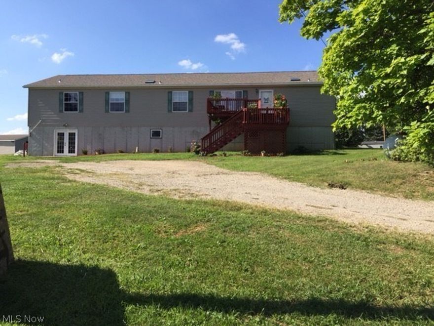 4 Bedrooms, 3 full Baths, 10+ Acres with a huge out building that could be turned into a garage. This home has a beautiful back deck and all appliances stay including a hot tub.  This is true country living. The home will also include a slate pool table, an Air Hockey table and a ping pong table for everyone to enjoy. Lot is wooded. Owner is unsure of mineral rights.