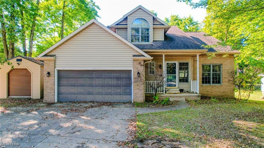Do not miss your chance to see this inviting home in Massillon-Perry Local Schools. Opportunities like this do not come often. Sitting on a .37-acre lot, this 2,048 square foot contemporary greets you with a welcoming covered porch and a two-car garage. Inside, cathedral ceilings and an open staircase set the tone for the spacious layout, with the living room flowing into the dining area. The kitchen offers generous cabinet space, appliances, and a bar top perfect for casual gatherings. The dinette opens to a cozy family room with a fireplace and French doors leading to the wood deck overlooking the backyard. A convenient half bath and laundry room complete the main floor. Upstairs, the owner's suite includes a private bath, while two additional bedrooms and a second full bath provide room for family or guests. The lower level delivers plenty of storage with the option to finish for added living space. Schedule your private showing today and see why this home is the perfect fit for your next chapter.