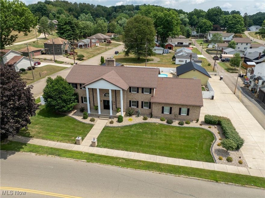 VISIONARIES, THIS IS FOR YOU, 1ST TIME OFFERED! Stunning 4BR/4BA, brick home designed w/future revenue/generating opportunities in mind! Luxurious entertainer's paradise offers unparalleled living, w/endless possibilities for hosting, renting, or relaxing. Open concept living room w/wood burning fpl. White Schrock kitchen, a chef's dream w/tons of space, modern appliances, & custom coffee spigot! Main floor bedroom & adjacent bath w/walk-in shower.  Spacious library/home office.  Bright & airy Florida room w/heated floor & wood-burning fpl.  Finished LL boasts private entrance, full bath, laundry room, stone wood-burning fpl, sauna, custom wine rack, custom bar w/solid brass rail, new dishwasher, & new Avanco commercial bar cooler! The fantastic master suite offers over 1,000sf of privacy w/sitting area, gorgeous pellet stove, & walk-out covered deck. Celebrity grade walk in closet must be seen...w/washer & dryer.  Luxurious master bath w/2 sinks, jacuzzi tub, & walk-in shower w/heat lamp. Quality throughout w/Schock cabinetry, solid hardwood doors, professionally painted, new flooring, updated lighting, new 75 gallon hot water tank, new water softener & more! Heated, extra deep & wide 3-car attached garage w/full kitchen, pellet stove, & storage. New vinyl privacy & aluminum security fencing in backyard oasis featuring heated inground pool w/waterfall & covered patio space w/ceiling fans.  Maintenance free landscaping w/sprinkler system. 2 detached garages & driveway parking for 12+ vehicles. Garages include 220v electric. PRIME LOCATION W/ENDLESS POSSIBILITIES ALLOWING YOU TO GENERATE INCOME W/EASE. Work & live in a beautiful space that provides ample meeting area & storage/parking for your existing business, Rent out the finished basement as a separate unit, Offer garage stalls for rent, host events in the expansive space, Create an Airbnb for short-term rental opportunities, develop professional office space. Don't miss this investment opportunity of a lifetime!