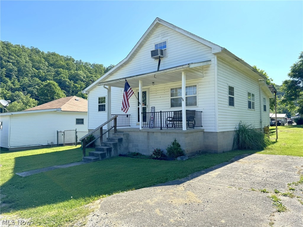 Affordable Home with Convenient Location - Discover this 3-bedroom, 2-bathroom home priced perfectly at $59,900, featuring a convenient master bedroom on the main floor and two additional bedrooms upstairs. This property, requiring some TLC, is move-in ready and sits on a manageable town lot with exceptionally low annual taxes of only $216. Enjoy newer wood floors in select areas of the home, alongside modern conveniences like a furnace, air conditioning, high-speed internet, natural gas, electric, and city water and sewer services. Step outside to a large back deck, ideal for relaxation or entertaining, complemented by a useful outbuilding perfect for extra storage. Situated within walking distance to the new city pool, park, and walking track, this home also offers proximity to essential amenities like grocery stores, shopping, and a 24/7 critical access hospital. Please be aware that the property is in the 100-year flood zone, and securing flood insurance is a requirement for all loans. Offering both affordability and potential, this property is an excellent choice for those looking for a starter home or an investment opportunity, providing a blend of comfort and convenience in a community-centered location.