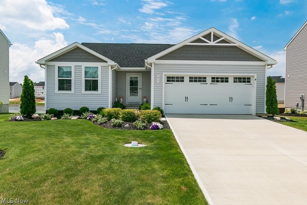 This stunning ranch was newly built with no expense spared! The first thing you'll notice as you walk up is the curb appeal. Complete landscaping all the way around the house with a stunning water view. Walk into your new home and you'll find a meticulously maintained home that has barely been lived in. 3 bedrooms and 2 full baths including a large master suit with a huge master bath and walk-in closet. Upgrades include granite counters, new stainless steel appliances, upgraded cabinets, tile back splash, luxury vinyl flooring throughout, updated light fixtures, cabinet handles and so much more! This beautiful open concept home is perfect! Plenty of cabinet space and gorgeous counters make this a cook's dream. The open concept is great for entertaining. Custom window treatments throughout are stunning! The full basement has seemingly unlimited room for storage, or finish it into the rec room of your dreams. Arguably the best point of this house is the backyard. A sprawling deck overloo