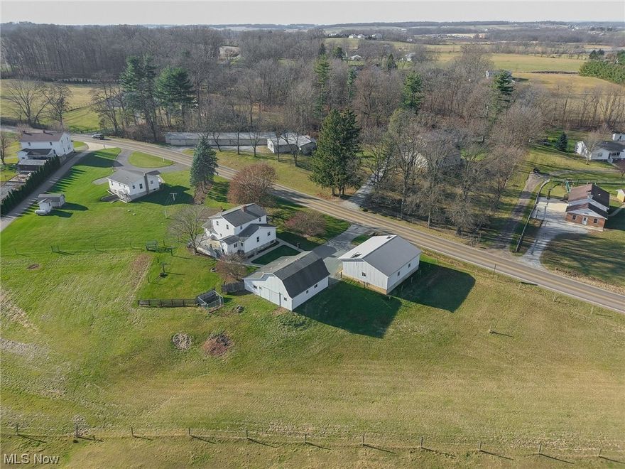 Property to be sold at Onsite Auction: Monday, January 8th at 4:00 PM. Located in a sought-after area of Wayne County, this 1,980 sq ft home is situated on 1.63 acres just outside of Apple Creek. The charming 2-story home offers 4 bedrooms and 1.5 bathrooms. Walk into an updated kitchen with new doors, drawer-fronts, counters, and sinks all upgraded in 2023, followed by a spacious living room with an abundance of natural light. The main floor offers a bedroom and full bath, as well as bonus rooms that can be used as an office space or sewing room. The second story is laid out with 3 more bedrooms and a storage room. The house is completed with a full basement that includes a summer kitchen, laundry, a half bath, and an outside entrance, ensuring ease of access. In addition, the basement offers plenty of storage room as well as a root cellar. The house is complemented by a 26’x 34’ barn with three box stalls, a feed room, a loft for hay storage, and an attached 12-ft lean-to that offers a small workshop w/overhead door. The pasture, approximately 0.8 of an acre, offers ample space for some livestock. Included with the impressive property is a 32’x42 heated shop w/that offers extensive storage or a perfect place for large family gatherings. Improvements include solar panels that stay with the property, new shingles on the house in 2013-14, and new concrete sidewalks in 2019. New windows were installed upstairs in 2020, and on the main floor in 2013-14. The home is heated with hot water heat that is heated with either a NG boiler or wood/coal burner. NG hot water, and private well & septic round out the utilities