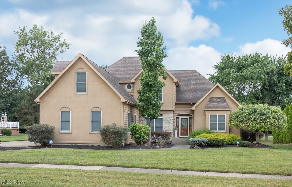 This custom-built home situated on a .45acre lot has been nicely updated & is ready for a new owner. This home has a first floor primary suite with tray ceiling, wood floors, walk-in closet & private bath with tiled floor, dual sinks, jetted tub & separate shower. The vaulted living room features a gas fireplace & large widows which overlook backyard & provide plenty of natural light. The kitchen features pantry with pullout shelves, updated Samsung black stainless appliances, cement countertops, tile floor & backsplash & is open the morning room with floor to ceiling windows. First floor laundry room with utility sink, 1/2 bath with granite counter & dining room which is currently used as an office complete the main level. Upstairs has a full bath & three additional bedrooms. The finished 13 course basement has a spacious rec room, furnace room & two additional storage areas one which makes a great workout room. Out back a covered rear deck steps down to a large brick patio with pergola.
Additional features and updates include: 9ft ceilings on first floor, walk-in attic storage through bedroom closet; attached 2 car garage with workbench, cabinets, peg board & new insulated door & opener 2022; high efficiency furnace & AC 2022, sump pump 2023, H2O tank 2015, Roof 2015, ADT security system with 6 cameras. 12-Month Choice Home Warranty Included!