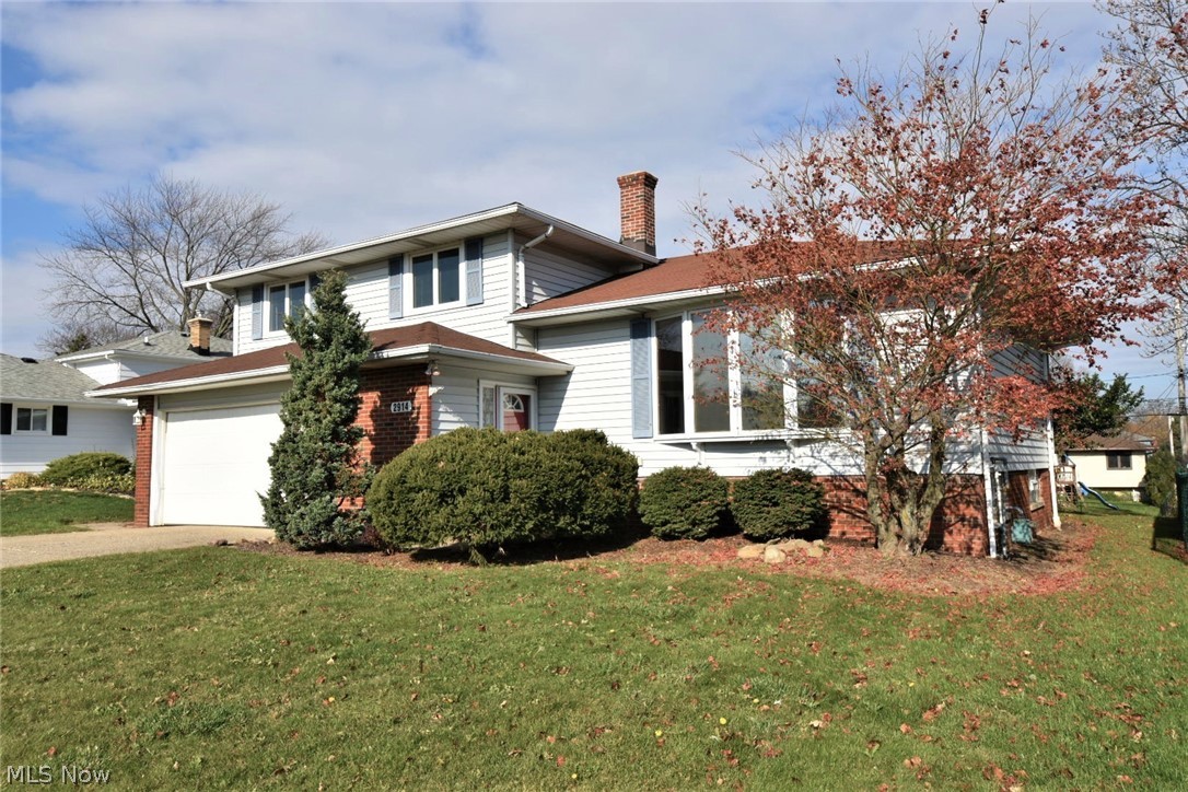 Welcome to this desired 4-level split just in time for the holidays! Enjoy entertaining in this spacious home. Step inside the large foyer and have plenty of space to welcome your guests and double coat closet to keep everything neat! Lowest level includes a 3rd living room for theater, gaming, sleepovers or more storage! Main level with covered deck is a wow factor as well as the gas stone-front fireplace with track lighting and potential closet or pantry storage! Step up just a few steps to the 2nd level of main floors with a spacious living room with bow window and newer carpet over hardwood floors - magnificent natural light shines throughout this home! 10x10 morning room with skylights as well as the formal dining room overlook the easy-maintenance fenced backyard. Gathering at the heart of any modern kitchen, there’s plenty of room to create and ample cabinet and counterspace to keep everything organized! Stainless gas stove and microwave stay as well as dishwasher, washer and