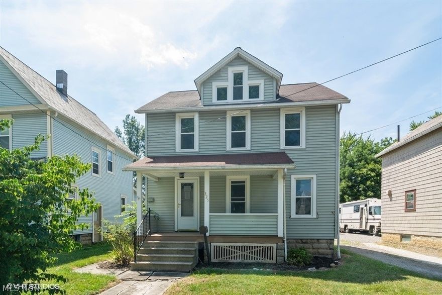 Lovely move in ready home located on a deep lot in Elyria. Relax on the front porch or back deck, entertain in the spacious yard and enjoy the convenience of a two car garage. Inside, you will find pleasing modern features including new white shaker style cabinetry in the kitchen with new stainless steel appliances, laminate flooring in the kitchen and formal dining room, new carpeting throughout the rest of the home and fresh neutral paint. The updated main bath is highlighted by a tiled tub surround for a custom look. A third floor offers plenty of storage space, as well as the basement.