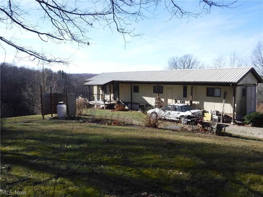 Early 1970's mobile home in fair condition with full, unfinished walk-out basement. Home has a metal roof added over top in 1994. Good water well and septic system capacity built for family of 5. Almost 4 acres includes a small machinery shed at bottom of hill with a separate driveway, woods, stream, open hillside field and potential pond site. Borders Woodbury Wildlife woods on east side. All mineral rights owned transfer. If you want an affordable get-a-way recreational property with easy access to Woodbury lands, this is it! Includes refrigerator, stove top and oven. Basement has floor drains, plumbed for future bathroom, wall unit propane heater in addition to forced air electric furnace and full air conditioning.