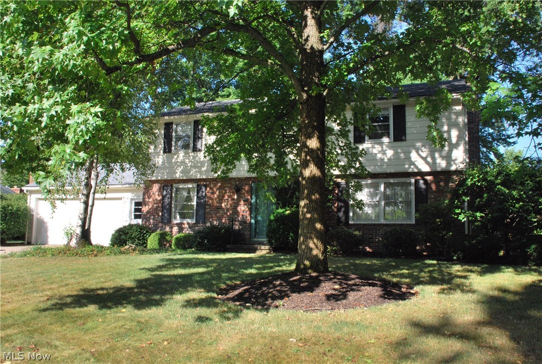 WELCOME HOME to 2525 Crestview Ave, Alliance OH, Stark County! A great size Center Hall Colonial Home with four Large Bedrooms (which includes 2 masters! One master with an en suite full bathroom & one without, both with 2 large closets) 2.5 Baths, 2 Car Garage, 1st Floor Laundry Room, Enclosed Rear Porch, Full Basement, Large Yard, awesome plantings, Original Owner home with large gorgeous yard & landscape. Lots of hardwood flooring throughout the home, all appliances included as well as the washer & dryer. This is your opportunity to live in a great neighborhood within a mile of Mount Union College & easy access to shopping & medical. The natural oak hardwood flooring is in all the bedrooms, which are upstairs. The front entry hall has a large closet & is flanked by the Dining Room & Living Room, also with hardwood flooring. The rear of the home has an eat-in kitchen with all appliances adjoining the bathroom & laundry room. The back Family room with bowed window overlooking the rear