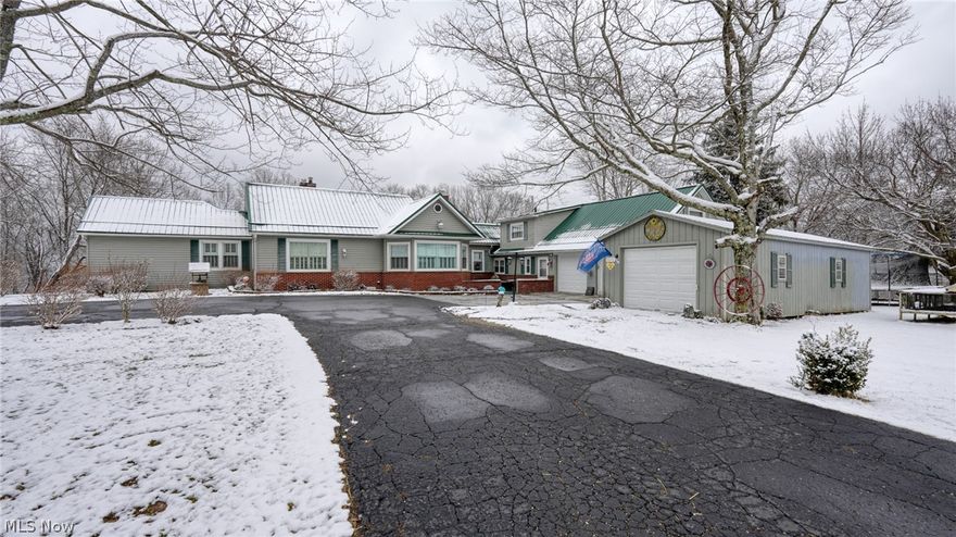 Beautiful country setting for this spacious home on 5+ acres. Not far from Salt Fork, I-77 & town. Newer in-ground salt water pool w/ turbo jet slide. Living room has brick fireplace w/ electric insert, wall mounted TV (stays), pretty window seat, huge dining room has counter & closet space, 2 kitchens, 1st floor family room, sun porch & rec room. Updates include: metal roof, most windows, whole house generator, plumbing, ext doors, & security system. Barn has 2 stalls & electric, pole barn & storage shed. MWCD assessment $6.00.year. Recently added livestock fencing & currently runs sheep on the property.