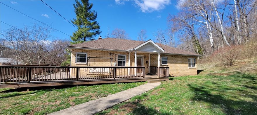 Brick Ranch Home with .29 of a acre. Three Bedrooms , One and Half bathrooms . Newly renovated kitchen with custom cabinets. Newer Appliances , Hardwood floors , newer roof , new furnace  and central air condition . Updated electric . On the first floor there are 3 bedrooms and a full bathroom, gas fireplace in the living room . In the basement is the garage , family room with newer carpet, Half Bathroom , storage room , washer and dryer hook up, and a utility room. Outside is a walk around deck , a  stream on the property