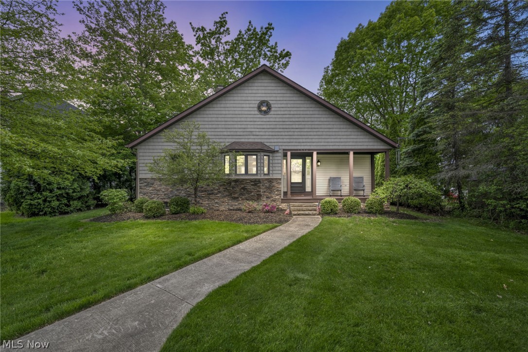 Prime location! Don't miss this exceptional waterfront home located right in the middle of Lake Roaming Rock. The property has an updated kitchen with beautiful cabinetry, neutral granite countertops, stainless steel appliances complete with a trash compactor and under counter ice maker. Looking out from the kitchen is an eye catching wall of windows for plenty of natural light with award winning views of the lake. The main floor has a separate primary bedroom with a large closet and full bath. There are an additional two bedrooms, full bathroom and laundry nook that complete the opposite side of the first floor. Overlooking the main floor is an over-sized loft with a view worthy window seat area being used as an office. As you make your way to the lower level you will notice a custom horseshoe railing as it leads to the recreational room with a stone wood burning fireplace. There are two additional sleeping rooms, full bathroom, and plenty of storage. The lower level provides a beautiful walk out to a covered patio overlooking the lake leading you to a multi-tiered Trex decking system with several areas to create a relaxing environment to take in sunrises and sunsets. The deck leading to the dock gives you plenty of space for your water crafts and toys. The owner is open to selling their two boats (jet boat and pontoon), jet skis and lake friendly water craft. Don't wait to see this incredible home.