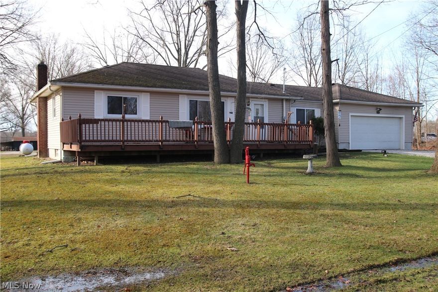 Whether you are looking for a summer retreat, full time home or a secondary income rental, 10024 Cummins Lane is it. This home is nestled in a quite neighborhood where you can enjoy a short walk down the road to Berlin Lake where you can put in your own dock! Enter into the living room featuring hardwood flooring and large window to let the sun in. Down the hall there are three bedrooms all featuring hardwood flooring and a full bath. The kitchen gives way to the finished breezeway with a sliding door to the large backyard. The full basement features the laundry area, HVAC and water softener system with plenty of room for storage or to be finished for extra living space. Don't wait, schedule your showing now! There is currently a tenant in the house that is supposed to be moved out by April 22.