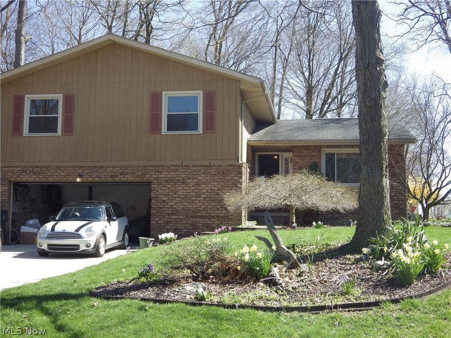 Come see this Gorgeous Bi-Level in the heart of Wadsworth! This home boasts a beautifully updated kitchen, 2 completely updated full baths and 3 spacious bedrooms! Neutral colors, plenty of natural lighting and wood accents throughout the home create the perfect canvas for you to make it your own! During the cold months get cozy in front of the stunning, floor to ceiling brick fireplace! Snuggled on a very well kept lot with a serene back patio/deck area that overlooks a tranquil built-in fountain for ultimate summer relaxation! This is a must see!