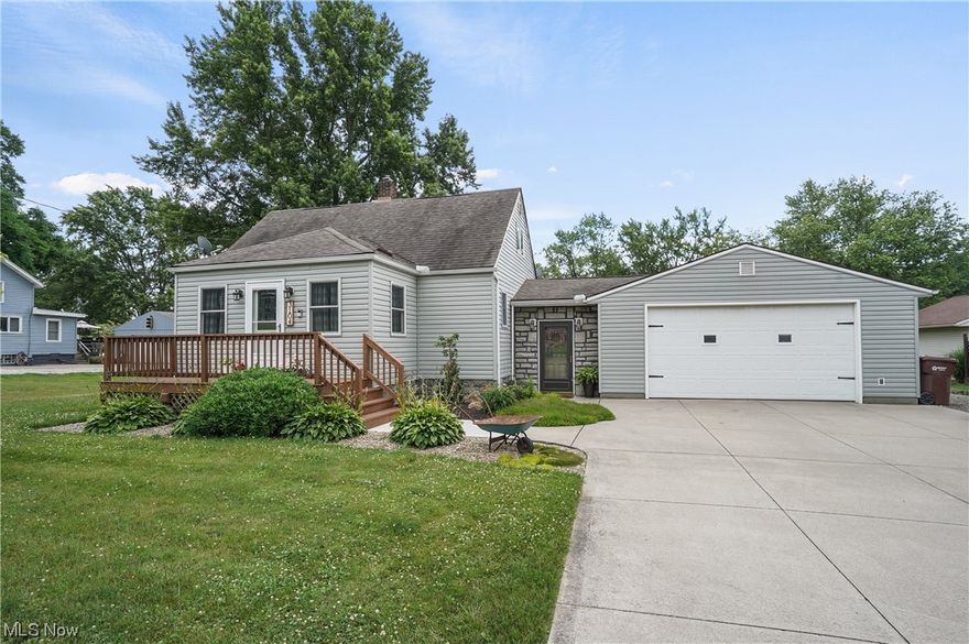 This immaculate Cape Cod in Springfield Twp features 3 bedrooms and 2 full baths situated on .75 acres! Oversized & extra deep 2-car attached garage, totaling 768 sqft --- a car enthusiasts dream! Extra wide concrete driveway. Inviting curb appeal with an updated front porch. Right away you'll notice the open floorplan with hardwood floors throughout the majority of the main level. The main living area has plenty of space for entertaining. The open kitchen has ample cabinets and countertops + stainless steel appliances, in which are included. Right off of the kitchen is accessible to the back deck with a built-in gazebo + a hot tub, overlooking the private backyard which is fenced in with storage shed with water & electric! Updated incredible full bath on the main floor. Two of the three bedrooms are on the main floor. Upstairs you'll find the open foyer room which is ideal for a playroom or even a home office. The third bedroom is right off of the foyer. Newer carpet throughout! The f