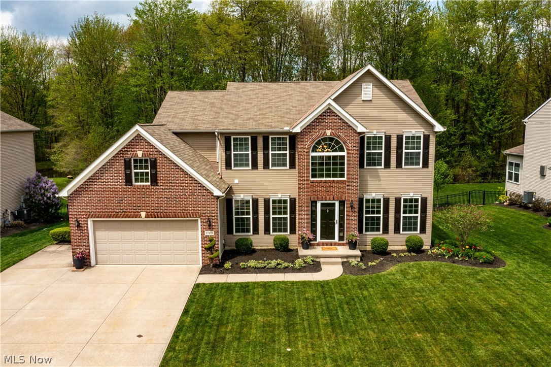Stunning colonial with over 3,400 finished square situated on a private wooded trail to the Avalon Estates pond. Step into the grand two-story foyer with gorgeous new hardwood floors throughout the first floor living areas. The perfect floor plan for today’s lifestyle where everyone can gather in the open living, dining and kitchen areas. Panoramic windows and a gas fireplace with ceramic tile surround provide the focal points in the living room. Enjoy cooking in the expansive kitchen which includes a huge center island with seating, lovely maple cabinets, tons of counter space, a pantry, and all the stainless-steel appliances plus an area for informal dining. The morning room is the perfect sunny spot to enjoy your morning coffee and includes a patio door to access to your fabulous outdoor entertaining space. The new custom hardscape 31x25 outdoor patio ($42,000 cost) with built-in lighting will be your summer paradise for entertaining, barbecues, dining alfresco and relaxing in this tranquil backyard with a wooded view and no rear neighbors. Back inside, you will treasure the holiday gatherings in the elegant formal dining. And working from home is a pleasure in the first-floor office with French doors for privacy. Upstairs awaits your owner’s retreat with his and hers walk-in closets, in-suite bath with a soaking tub, dual sinks and a shower. There are three additional nicely sized bedrooms with large closets and a full bath with a tub and shower combination. But wait, there’s more in the finished basement! The media room is wired for sound for watching the big game and includes a bar to serve your favorite refreshments. There is also a finished recreation room which would be perfect for a play area or exercise room. And the daylight section of the basement could be finished for a 5th bedroom or guest suite plus there is a rough-in for another bathroom. Easy highway access and close to shopping and dining at Avon Commons or Crocker Park. A picture perfect home!