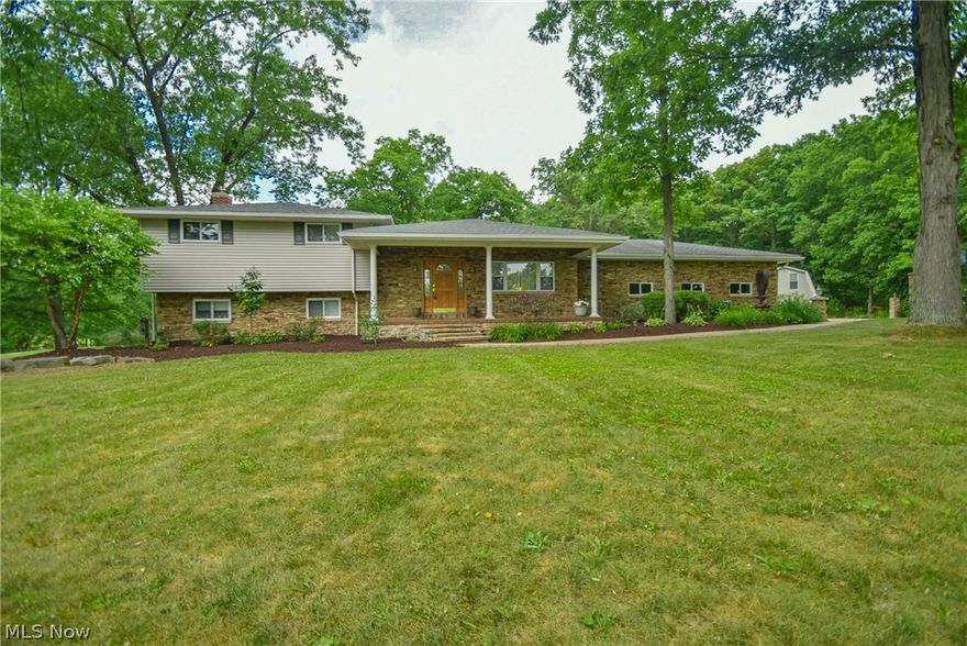 Welcome home to this IMMACULATE 4 Bedroom 3 Bath Split level home with two car attached garage situated on over 9 Acres with a pond! The covered front porch leads into the great room on the main floor which is open to the large dining area and kitchen which features high quality Oak cabinets, all appliances stay, and sliding glass doors to the brick patio overlooking the pond. The main floor also features a first floor laundry, and large walk-in pantry/ storage room. A huge 25x15 Sun room was added to the home with hot tub over looking a beautiful pond and secluded wooded backyard. Upstairs are 3 bedrooms, remodeled bathroom with heated floors. In the lower level the family room with fireplace & door to the outdoor entertainment area offering 2 patios! Also in the lower level is a 4th bedroom or office, & full bath. The basement level offers additional finished space currently used as a work out room, & storage. Huge 7 car outbuilding for the car enthusiast or additional entertaining a