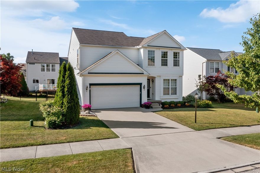 Amazing 3 bedroom, 2.5 bath home in the New Hampton neighborhood with an open floor plan and a finished lower level! Located in the New Hampton neighborhood, this home is in an amazing location with so much to love! Step inside and you will notice beautiful new laminate flooring (2019) throughout the entire main level. There is a perfect office space to the right, great for the work from home life! The family room offers high ceilings, huge windows for an abundance of natural lighting. and opens into the eat-in kitchen. The updated kitchen offers soft close white cabinetry (2018), LG stainless steel appliances (2018), center island, and sliding door access to the back patio. There's also a sliding door off of the kitchen that leads into the first floor laundry room (Samsung washer/dryer 2017) and garage. Head upstairs to the spacious master suite with an attached master bath with double sinks. The additional 2 bedrooms are both nicely sized with convenient access to the full bath. The