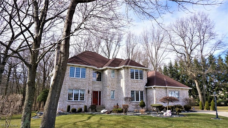 Private setting on Bentley Place cul-de-sac! Beautiful brick colonial constructed with contemporary floor plan. From grand 2-story Entry with winding staircase to Great Room with Vaulted ceilings, this sprawling first floor has plenty to offer everyone. Massive Eat-in Kitchen is fully equipped with modern high-end appliances and recently updated Brazilian Cherry Hardwood Flooring. Kitchen boasts large island for gathering with bar seating along with walk-in pantry. Dinette area is perfect for high-top table for quick meals. Two steps down to Vaulted Great Room with great wall of windows, built in speakers for surround sound and unique overlook from 2nd floor loft. Adjacent to Kitchen is the Sun Room with Vaulted Ceiling has access to composite deck with solar lighting and views of private wooded backyard. First floor also offers a formal Dining Room with chair rail, crown molding, and stunning bay window; Living Room has gas fireplace with marble and wood finishes, large windows and re