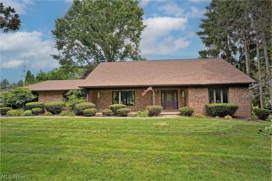 This 4 bedroom 2½ bath home sits on just over an acre of land in a small, quiet neighborhood. The foyer opens to a formal living room with shelving and cabinet storage. The eat in kitchen is sure to please with stainless steel appliances, ample cabinetry, prep space, beautiful back splash, planning desk, pantry, and breakfast bar seating. The kitchen opens to the cozy family room with a fireplace and a beamed ceiling. Adjacent from the family room is a wonderful bonus room that can be turned into a formal dining room. Three seasons sunroom(rebuilt in 2016) offers access to the patio and fully fenced in yard. First floor master suite offers an en-suite bath. The laundry room and 1/2 bath complete the main level. New flooring throughout the first and continues to the second level. Upstairs you'll find 3 sizable bedrooms with an updated full bath. One of the upstairs bedrooms has attic access. The lower level offers a partially finished basement that is ready for your own personal touche