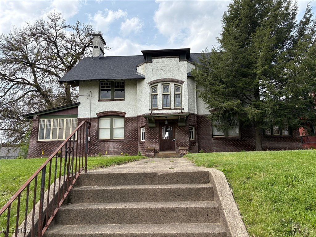 Beautiful Canton Tudor Office Building recently updated to maintain its architectural integrity of the 1900?s. This property would also be a great residential home for someone with a home business. Great location just minutes from Downtown Canton, Historic Ridgewood, Malone College and quick highway access. Beautiful woodwork craftmanship throughout. Hardwood and slate flooring. Multiple offices on the 1st floor, full kitchen, library. Stain Glass Window featured above the staircase to the 2nd floor. 3 offices/bedrooms on the 2nd floor with 2 baths and 2 offices/bedrooms and bath on the 3rd floor. Fenced yard, 4 car garage. Roof is 2 years old, new furnace + additional furnace for 2nd and 3rd floor heating. Central Air is 5 years old. This is just a few of the many updates in this property. Ideal for professional office users or retail services.