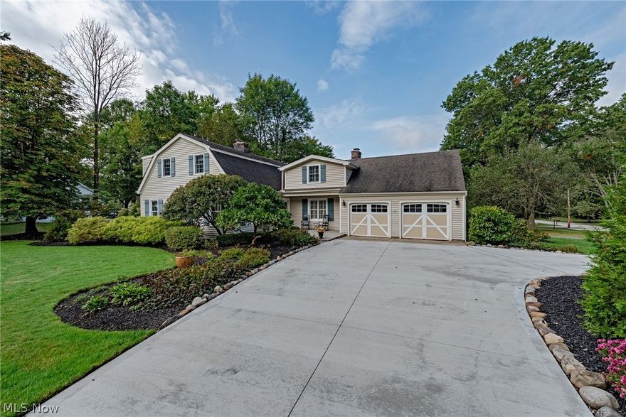 Prepare to be delighted by this charming colonial in Chagrin Falls! This beautifully maintained home provides 2,700 square feet of living space with elegant finishes throughout and a serene back patio. As you step inside, you'll find a comfortable living room with a brick fireplace to your left. Hardwood floors flow into a sunny office with built-in shelving and a desk, plus a concealed bar that is built into the closet! The formal dining room also features nice hardwood floors and crisp molding. The kitchen has been recently updated with granite counters, stainless steel appliances, and plenty of cabinetry. Off of the kitchen, there is a gorgeous family room with a fireplace and sliding doors that open out to a beautiful sunroom with a natural wood ceiling. A full bathroom completes the first floor. Upstairs, you will find three bedrooms and two bathrooms. The owner's suite includes a recently remodeled bathroom with a step-in shower, a large bedroom, and ample closet space. Two other