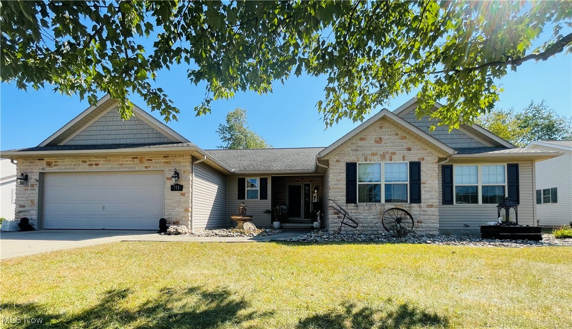 This custom built ranch was designed with comfort and connection in mind. Stepping into the heart of the home you’ll find an open concept layout that is perfect for entertaining and family. The vaulted ceiling living room centers around a cozy stone gas fireplace that flows into the dining area and kitchen. The stunning kitchen with quality custom Mullet cabinetry, stainless steel appliances, pantry, under cabinet lighting and more is a chef’s dream. The dining area leads you onto a large rear covered porch and into a beautiful private fenced lawn. Enjoy the additional tile paver patio with brick fire pit for quiet evening serenity. Off of the great room you will find a generously sized master suite, large master bath and walk in closet. Two additional bedrooms, a second full bath and first floor laundry complete this main level. You will love the tastefully and thoughtfully finished 1120 sq. ft. basement, 13 course high; complete with wet bar, large media room, 4th bedroom, gorgeous full bath with designer custom shower. The basement includes multiple storage rooms and closets. This amazing home features a 2-car garage, a unique designer driveway design and quality landscaping in a friendly neighborhood. Don’t miss your opportunity to enjoy comfort, convenience and a touch of serenity in this thoughtfully designed and well cared for ranch home. Shed will stay, Hot Tub does NOT stay.