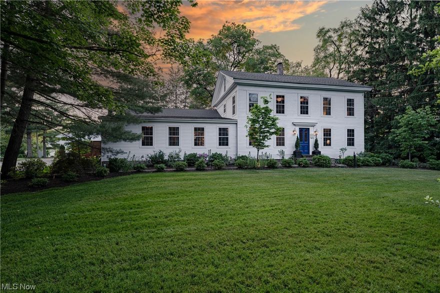 Situated on over 6 acres in Chagrin Falls lies this unexpected 1867 jewel box, without question one of the finest restorations ever offered for resale. Unbelievable care has been taken to design open, modern living areas that operate in concert with the original details of the home. With an eclectic mix of custom finishes and an unparalleled attention to detail, every corner offers a new surprise and a perfect balance between historical character and modern living. The entry leads to formal living and dining rooms with fireplaces, incredible millwork, and rich hardwood poplar floors that flow throughout the home. Directly off the dining room is the butler’s pantry boasting marble counters, a reclaimed tin ceiling, and access to the open family room. The kitchen is a masterpiece unto itself with stunning granite counters, hand-crafted cabinetry, bespoke hardware, and a massive island. Open to the kitchen, the gracious family room and informal dining room offer the perfect place to gathe