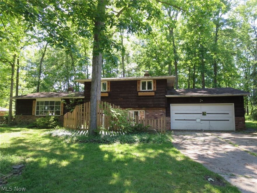 Spacious Split-level in a wooded setting in Heather Hill Estates. L-shaped living/dining room with eat-in kitchen, step down to the family room with fireplace plus office and half bath.  Upper level offers a master suite and 2 more bedrooms and another full bath. Basement is partially finished for even more living space. Access to 2 car garage from family room. All on nearly 3/4 acres. This is a Fannie Mae property.