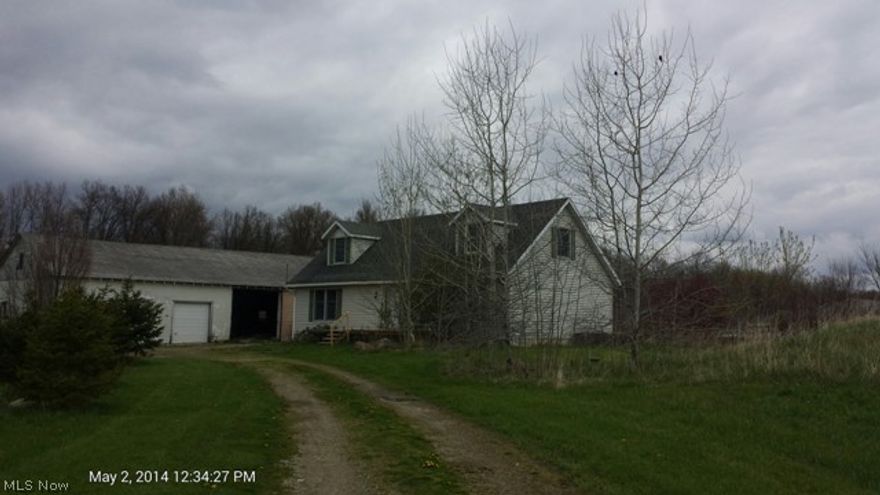 Great Potential with this newer Cape Cod located on over 2 acres. Large out building that needs some work. Sold As Is!