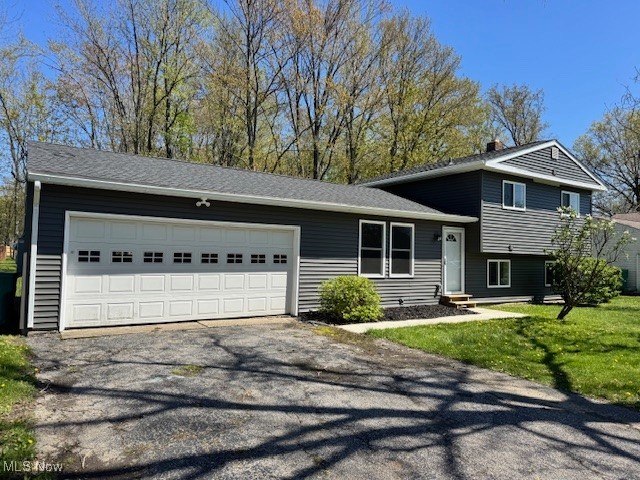 Welcome to 7942 Bellflower Road, a beautifully updated split-level home in Mentor. Originally built in 1966, this 1,460-square-foot home has been completely modernized in 2024. Step inside to find new laminate flooring and plush carpeting throughout. The home features three spacious bedrooms and two fully remodeled bathrooms, perfect for both relaxation and convenience. The kitchen shines with white cabinets, granite countertops, and ample storage. Key upgrades include new windows, roof, siding, and a HVAC system and all new electrical wiring and panel. There is an attached two-car garage that provides additional storage and convenience. This move-in-ready gem combines modern updates with timeless! Make an effort to see this home soon!