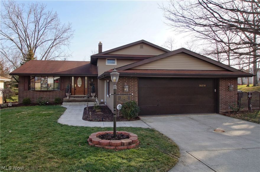 Welcome to this gorgeous 4 level Split Home immaculately cared for with tons of updates! Remodeled Kitchen with bay window, high-end cabinetry, ceramic tile floors and backsplash, and frosted Pantry doors. Spacious Living Room and Dining Room with beautiful rear views of the property. Family Room with custom stone gas fireplace, newer carpet, programmable thermostat and sliding doors to the rear covered Patio. Half Bathroom and Laundry Room complete the Lower Level. Master Bedroom offers wood floors, walk-in closet and full Bathroom. The third floor in completed with 2 additional Bedrooms and a full Bathroom. Basement offers plenty of storage space or workshop area. 2 car attached Garage with door opener and Ever Stone floors (2008). Beautifully manicured yard with lush landscaping and storage shed.  Updates include: 10’ attic insulation, vinyl windows (2007), A/C and furnace (2005), hot water tank (2012), rear yard and covered Patio (2010), vinyl siding, front concrete walkway. Don’t