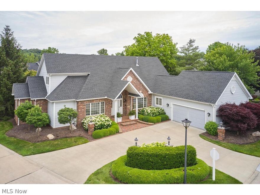 One of the nicest units in all of Lake Pointe! This 3 bedroom, 3.5 Bath, renovated Colonial cluster home with 180 degree water views of one of the ponds at Crystal Lake.  Numerous updates include restained deck (2022), interior paint (2021), luxury vinyl floors throughout main level (2021), quartz countertops in kitchen & family room (2021) & new stainless steel Whirlpool appliances in kitchen (2021), 2nd floor new carpet (2021), new hardware & lighting (2021), & much, much more! Open floor plan concept with high ceilings, tons of natural sunlight, and top-of-the-line finishes throughout.  Spacious chef's kitchen is the center of the home and features a large island and is open to the breakfast room. Vaulted Great room with gas fireplace & wall of windows overlooking the water. Family room w/wet bar, quartz counters, and fireplace. Stunning sun room with slider to large deck overlooking the water, ideal for outdoor entertaining! Renovated owner's suite with master closet (2021). Formal Dining room. Private office. Laundry room, half bath and pantry room/additional office/other room complete the main level. 2nd level features 2 en suite bedrooms plus a loft. The finished lower level features large rec room. Extensive professional landscaping. 2 car garage w/custom cabinets & flex core flooring system (2009).  Circular Drive. Convenient location, minutes to Montrose and easy access to Cleveland/Akron via highways. You don't want to miss this one!