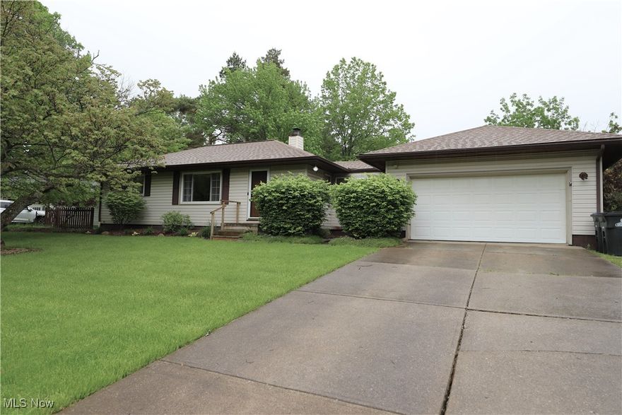 Welcome Home to this beautiful Ranch nestled on a beautifully landscaped .51 acre lot. The updated Kitchen offers hickory cabinets, stainless steel appliances, countertop dishwasher, and a dining area. Oversized breezeway perfect for mud room, office or play area.  Spacious Family Room with LTV flooring. Updated full bath. Large Primary Bedroom plus 2 additional bedrooms with hardwood flooring. 1 of the Bedrooms offers a cute built-in loft bed.  Awesome finished basement offers a huge Rec Room, loads of storage & an additional finished room perfect for an office nook. As you step into the back yard, there is a custom Deck with Gazebo(2024), 4 ft. above ground swimming pool (2021), Hot tub, shed, &  playset. Other updates include: Roof and gutters 2021, sump pump 2024, some plumbing 2024.  The basement was professionally waterproofed by Ohio State Waterproffing and comes with a transferable warranty.-$75 yr. (was done 2014).  Pride of ownership is evident here! A must see!