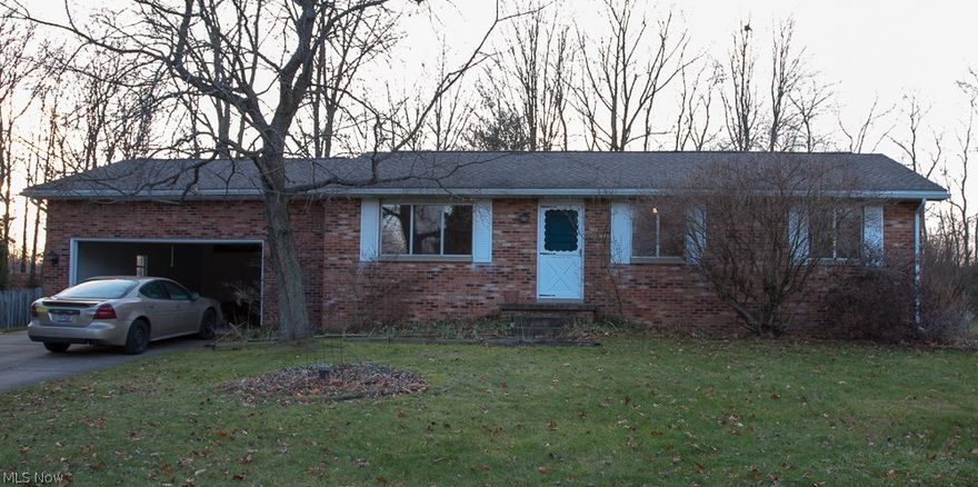 Enjoy your own little piece of serenity in this lovely 3 bedroom home tucked away right behind Wingfoot Lake Park.  This 3 bedroom home has been freshly painted throughout and brand new flooring throughout the entire home as well. (Modern/neutral colors).  Enjoy the spacious rec room with fireplace, perfect for entertaining.  The master bedroom has a half bath.  Other amenties include enclosed patio, attached garage, formal dining room and more.  This home is priced for a quick sale.  Call for your showing today!!