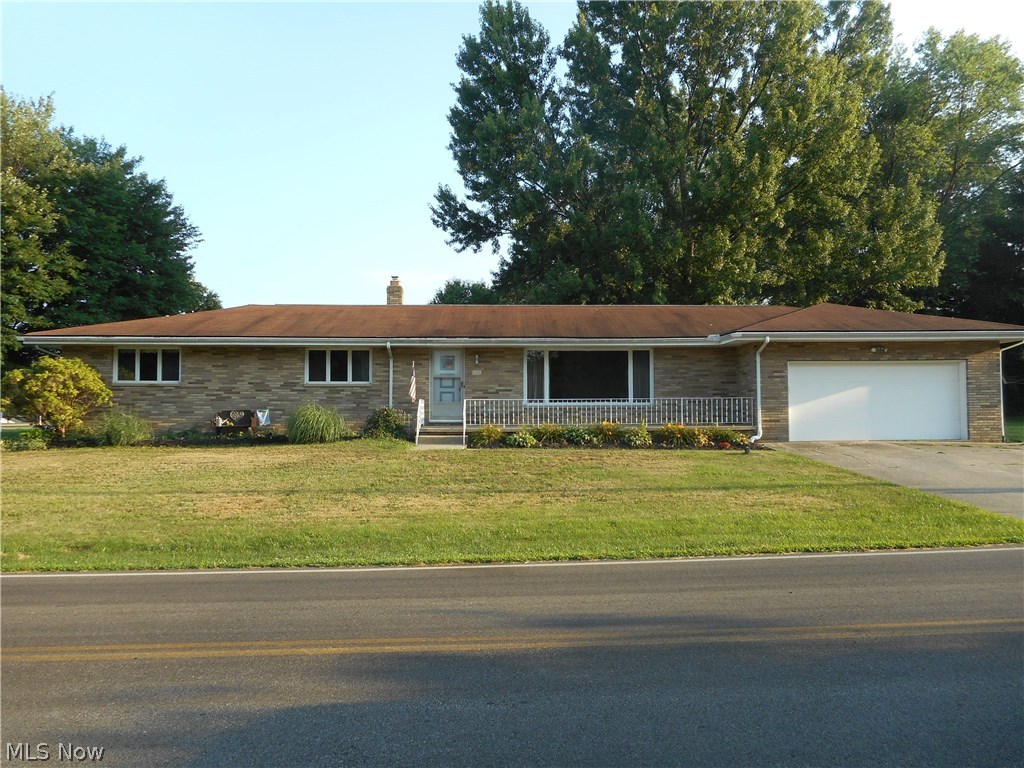 Watch the sunrise from your front porch while drinking your coffee! Rarely available all brick ranch in Tallmadge! This property offers a lot of room - formal living room with nice built in's, 3 bedrooms, 2 1/2 baths including a master bath. Eat in kitchen offers plenty of cabinet and counter space, has a separate counter perfect for serving guests & has a large pantry. Spacious family room offering hardwood floors, wood burning fireplace and sliders to the huge porch. There's even a first floor laundry area. Conveniently located close to schools and rec center. Updates include (2018): Caulked exterior wall and patio joints. Dry Lock painted interior basement wall which is covered by a 10 year transferrable manufacturer's warranty.