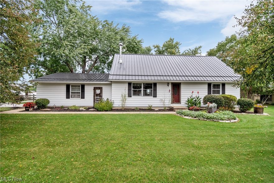 Welcome home to this charming 4-bedroom, 1.5-bath home in the quiet countryside of Lagrange, Ohio. This meticulously maintained property offers a peaceful retreat on a spacious 1-acre lot, boasting a fully fenced in backyard and large sunroom off the back of the house. One of the standout features of this property is the detached barn, complete with separate propane heating, electric, and water connections. This versatile space can serve as a workshop, storage area, or studio. You’ll love the updated kitchen (all appliances stay) and bathroom; as well as the fully functioning/maintained wood-burner in the living room; perfect for those cold winter nights! The spacious master bedroom is located on the first floor with 3 large additional bedrooms; 1 on the main floor, 2 upstairs. This property also offers a fully finished basement with beautiful barn wood lining the walls. Enjoy country views from your sunroom which adds even more living space! Updates include: New metal roof w/ 3 year w
