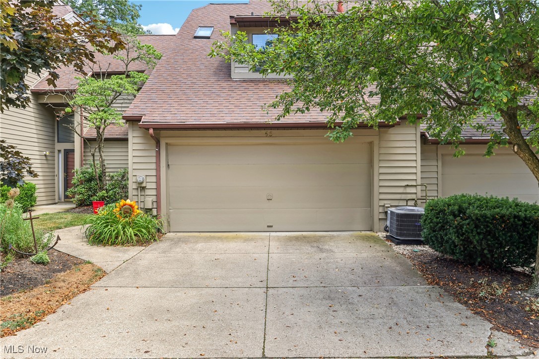 Rare opportunity in Forest Cove at Portage Lakes! This 2-bedroom, 2.5-bath condo offers a light-filled, open layout. A dramatic two-story foyer leads into the vaulted great room, featuring skylights, a fireplace flanked by dual sliding doors, and access to a freshly painted deck. The formal dining room and spacious kitchen with center island and dinette area also open to the deck is perfect for entertaining. The first floor includes a convenient laundry room and a wet bar area. Upstairs, an open loft overlooks the great room and is currently used as an office. The primary suite offers a private balcony with seasonal lake views, a walk-in closet, and an en-suite bath with a jetted tub and separate shower. The guest bedroom is vaulted and has access to its own full bath. Additional highlights include a 2+ car attached garage with pull-down attic stairs for extra storage. Recent updates including a new furnace, A/C, and water heater in 2023, and a microwave in 2024.