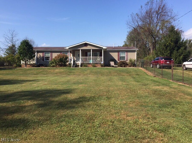 This move in ready manufactured home is just waiting for you to call it home. From the driveway leading up to the home to the fenced in front yard as you relax on your front porch watching your fur babies run. Enjoy the side porch as you watch the deer and turkey meandering about in your back yard on that quiet evening sunset. Enjoy exploring? Enjoy the 3.97 acres, most of it cleared and cut, but venture into the woods and check out the creek that flows through the property. A piece of paradise is waiting for you, call now for that private viewing.