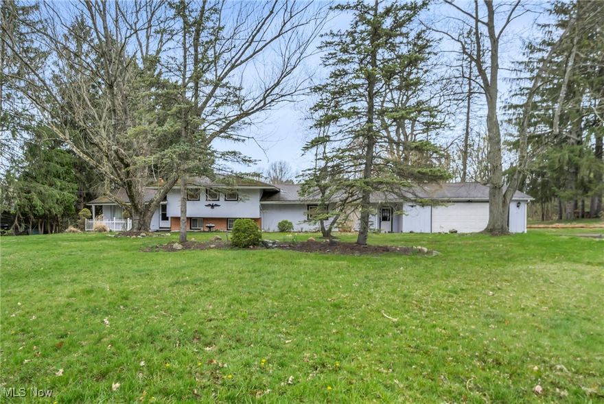 Location, Location, Location! Welcome to the home you’ve been waiting for—nestled in the beautiful city of Walton Hills. Perfectly situated on a private, nearly one-acre lot, this uniquely built split-level home offers a rare combination of space, comfort, and convenience. Enjoy easy access to Metroparks, hiking and biking trails, shopping, restaurants, and major freeways—all just minutes away. Designed by the original builder/owner with functionality in mind, this spacious home features 4 generously sized bedrooms, including a primary suite with a en-suite bathroom. The formal living and dining rooms offer elegant spaces for entertaining, while the expansive eat-in kitchen provides ample cabinet and countertop space for all your culinary needs.
The large family room with vaulted-ceiling boasts a cozy fireplace & opens to a screened-in patio—perfect for relaxing and a view of the serine rear yard. Two additional rooms with closets can serve as a home office, in-law suite, or guest bedroom. Home Being sold as-is, Bring your decorating skills and make this home a MasterPiece. (Roof Repaired 2020 above spot on living room ceiling}
Additional highlights include two workshops or storage areas, a breezeway, an attached 2.5-car garage, and a rear deck ideal for entertaining. This home offers a unique blend of privacy, space, and location—don’t miss the chance to make it yours!