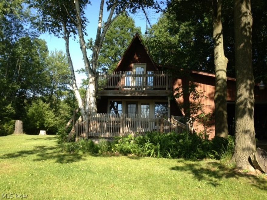 Nice 2 bedroom, 1 bath 2 story A Frame with Lake View in nice secluded wooded area. 2 car attached garage, balcony off upstairs bedroom, front deck, wood burner. Close to Lake Milton, Ohio's 72nd State Park. Amphitheater, beach, swimming, fishing, boating, walking and jogging trails, plus golf, wineries and shopping.