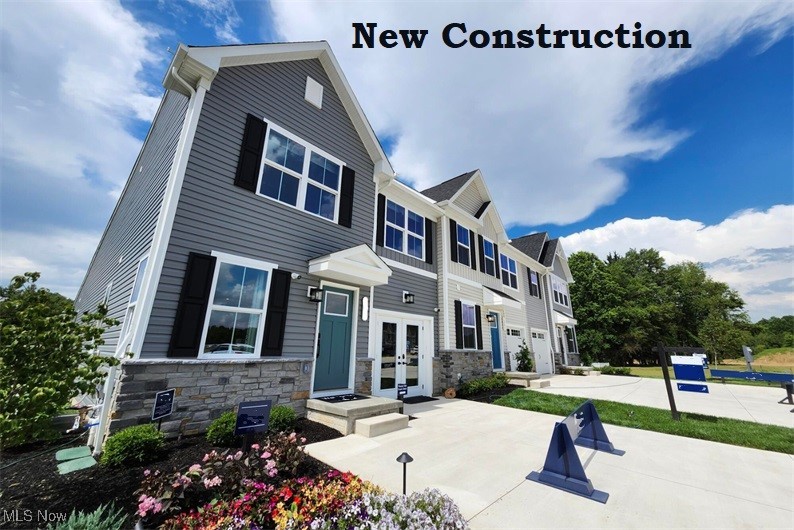 MOVE IN READY! 15 YEAR TAX ABATEMENT! END UNIT – FIRST FLOOR LIVING This first floor living townhome is surrounded by the Cuyahoga Valley National Park!! Enter your brand new home through the one-car garage and step right into the gorgeous gourmet kitchen with granite countertops and included stainless steel appliances. The huge center island overlooks both the inviting great room and the formal dining space. Entertain family and friends here or outside on the included covered outdoor patio. The main level also includes your luxury owner’s suite, which features a dual vanity bath and huge walk-in closet. Upstairs, you’ll find two spacious bedrooms, a full bath, and unfinished storage that is huge. Enjoy the gorgeous community center which is another home away from home with fitness center and pickle ball courts with outdoor living area as well! You need to see this to believe it! Schedule an appt today.