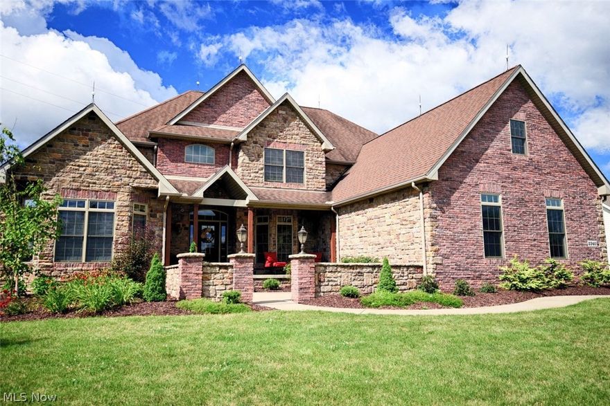 Welcome to 2340 Carrie Way. This is a stunning custom built colonial with an open well designed floor plan.  As you drive up to the home the stone front will catch your eye. The front sidewalk leads up to open courtyard and a large front porch. As you enter the home it opens to a two story foyer. Off the foyer is the master suite & the formal dining room. The master suite has vaulted ceiling‘s & a large spa like bathroom. As you head past the stairs, the foyer opens to the great room. It a wall of windows which are nicely trimmed with poplar. The fireplace in the great room is wrapped with stone and poplar. From the two-story great room you can see winding stairs heading upstairs & into the kitchen. The kitchen has large island, granite counter tops and a brick wrapped cooking area. Off the kitchen you’ll find the laundry room & a half bath. You also have access to the 3 car garage from this area. Heading upstairs you’ll find a teen suite with a large walk-in closet & a private bath. T