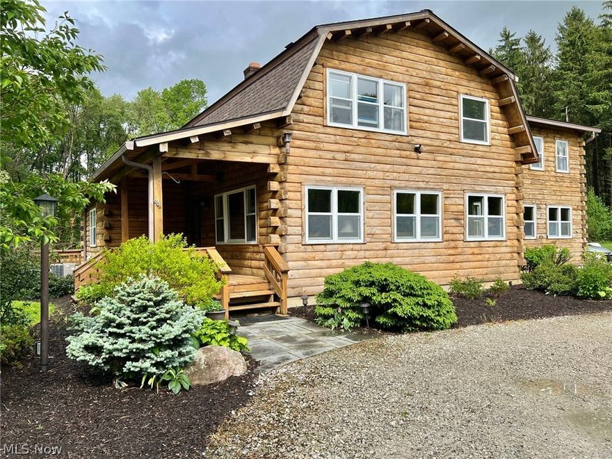 RETREAT to the Country to this Custom Built Log Home nestled on 18+Peaceful Acres! This One-Owner home is warm and inviting and offers great living space with 4 Bedrooms, 3 Full Baths, flat log interior walls and beamed ceilings throughout. Spacious Living Room & Family Room both have wood burning stoves for additional heat source and newer wood laminate flooring. Completely remodeled Eat-in Kitchen with center island breakfast bar, granite counters, walk-in pantry with prep sink, all appliances, ceramic floor, new lighting fixtures and dining area with sliders to deck. 1st floor office & full bath. All 4 Bedrooms on second floor have wood floors including Vaulted Master Bedroom with walk-in closet, 2nd closet & Master Bath with double sink vanity. Full partially finished basement includes workshop, laundry area & great storage space. Central air. Roof has been recently replaced in 2022. Please note: Exterior of home and deck are in process of being professionally stained. This wonderful family home is set back over 500 ft off the road, secluded and surrounded by mature trees & wildlife. Relax on the covered front porch or the expansive 2-tiered deck with built-in bench seating and enjoy the views of nature! Bike or hike the bordering Maple Highland Trail this summer and just minutes to Chardon Square! Berkshire Schools.